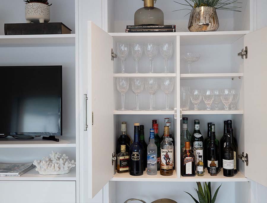 shelving holding wine and glasses
