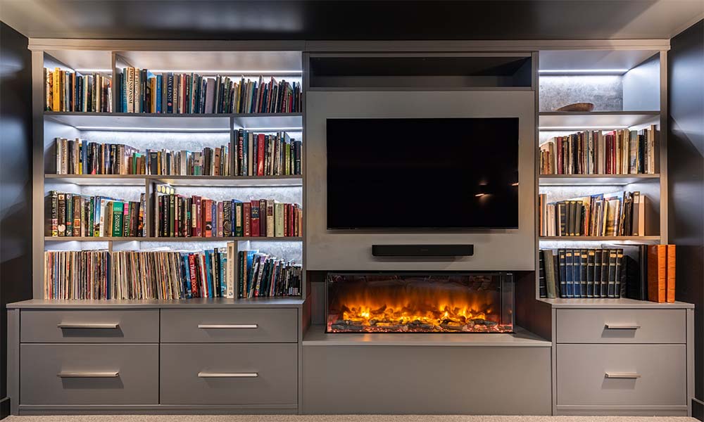 media unit with fire and books on shelves