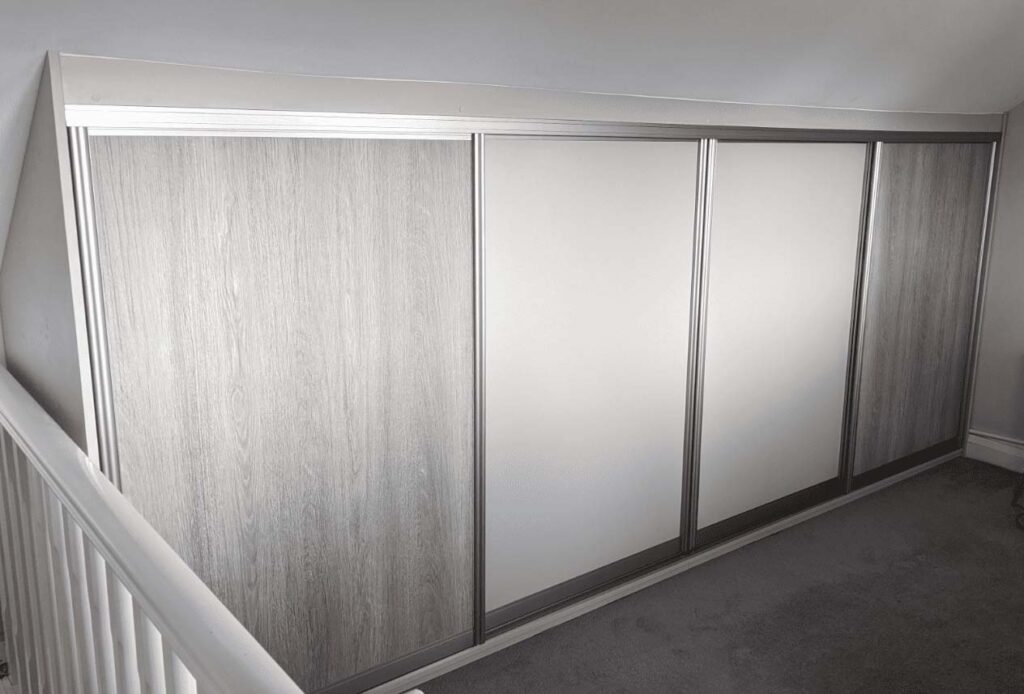 small sliding woodgrain wardrobe
