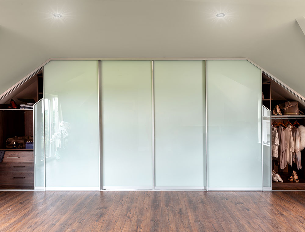 white glass sliding angled wardrobe