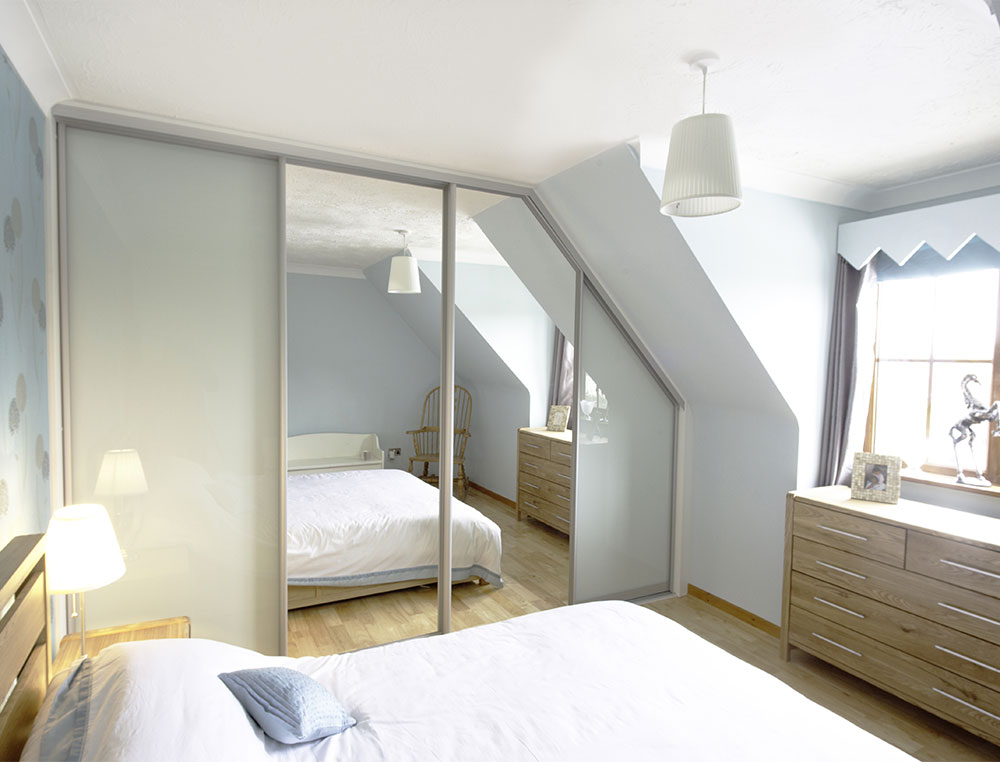 mirrored sliding and glass wardrobe